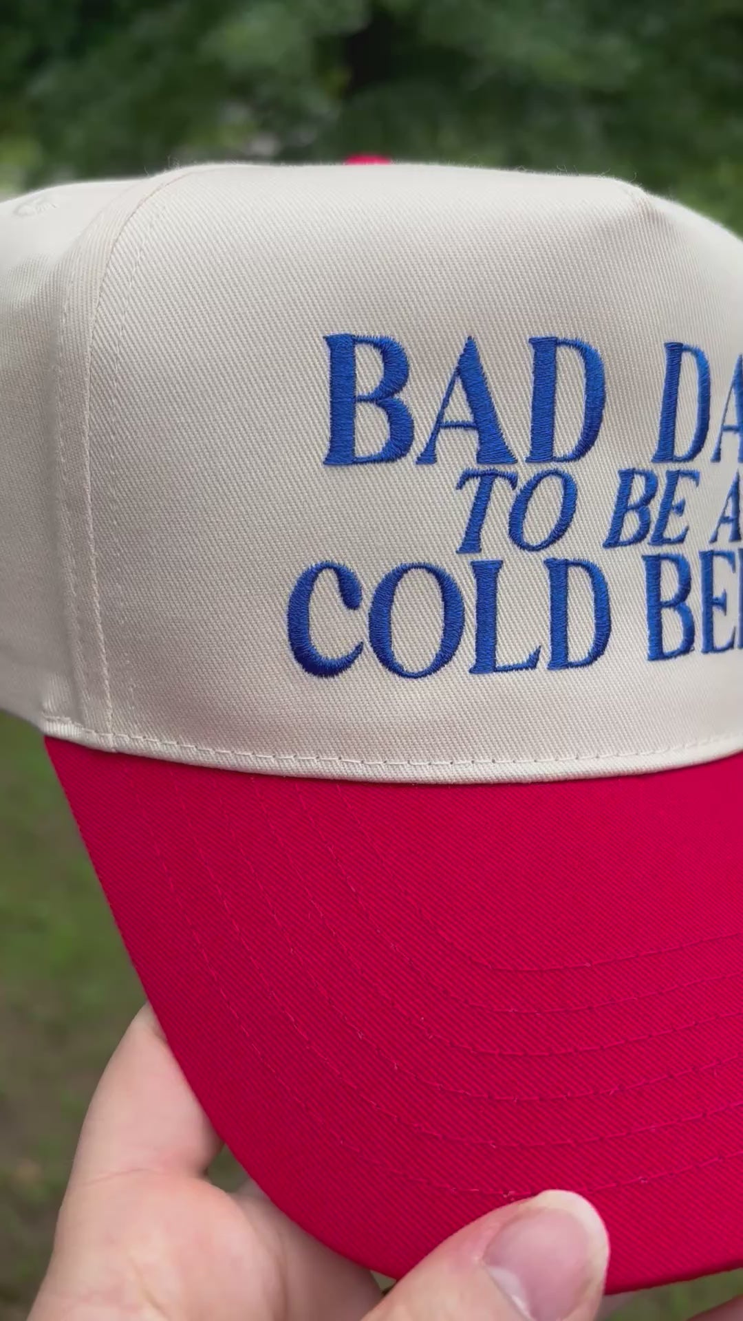 Video of cap with Bad Day to be a Cold Beer text rotating from side to side